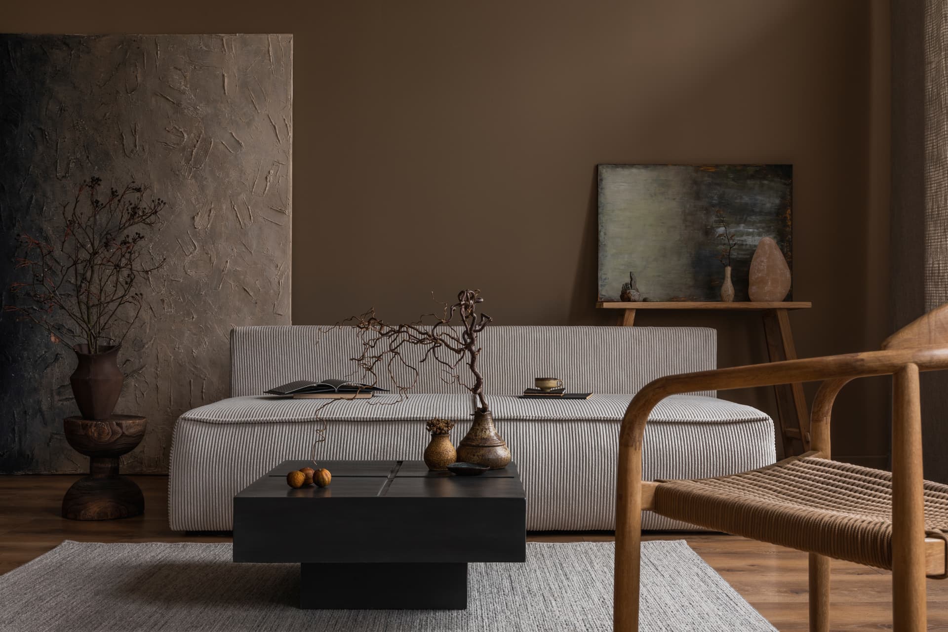 Warm Japanese-inspired living room with corduroy sofa and black low table